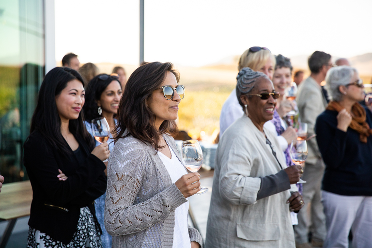 A group of people at a vineyard event