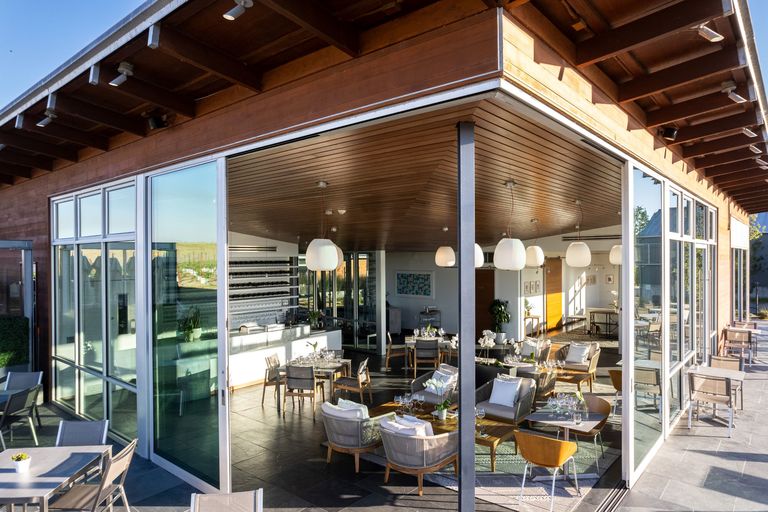 Exterior shot of the empty Cuvaison tasting salon, looking in from the patio
