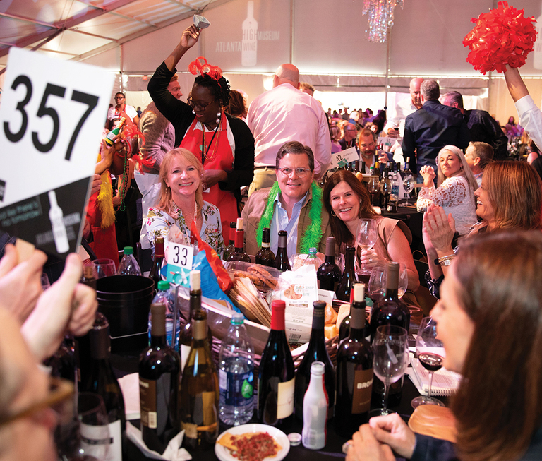 A group of people celebrate at Atlanta's High Museum auction