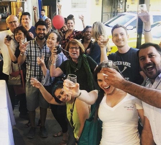 A group of happy people at a wine festival