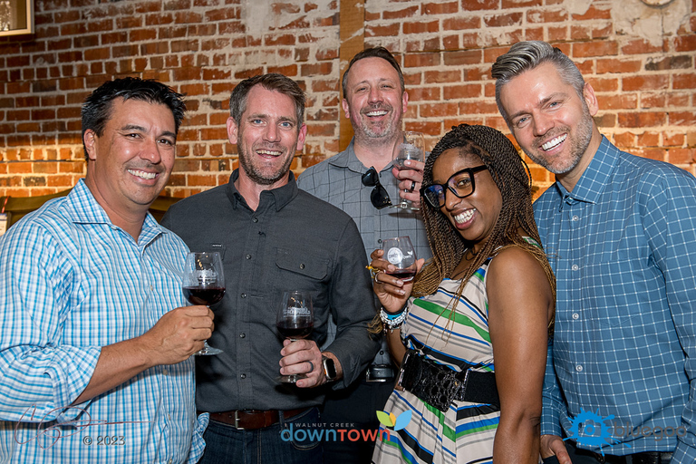 A group of happy people at a wine festival