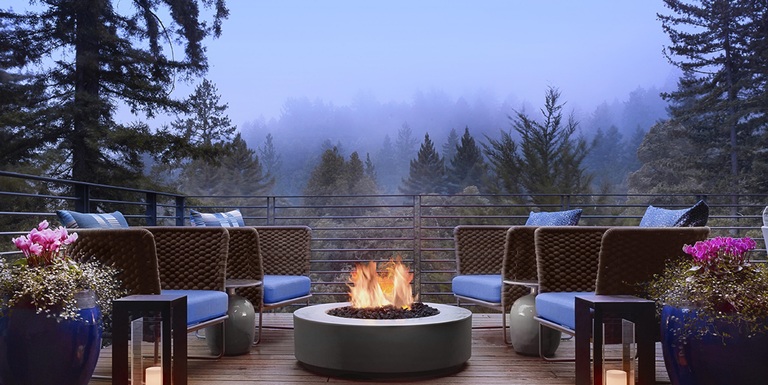 Twilight on a patio overlooking Redwood trees