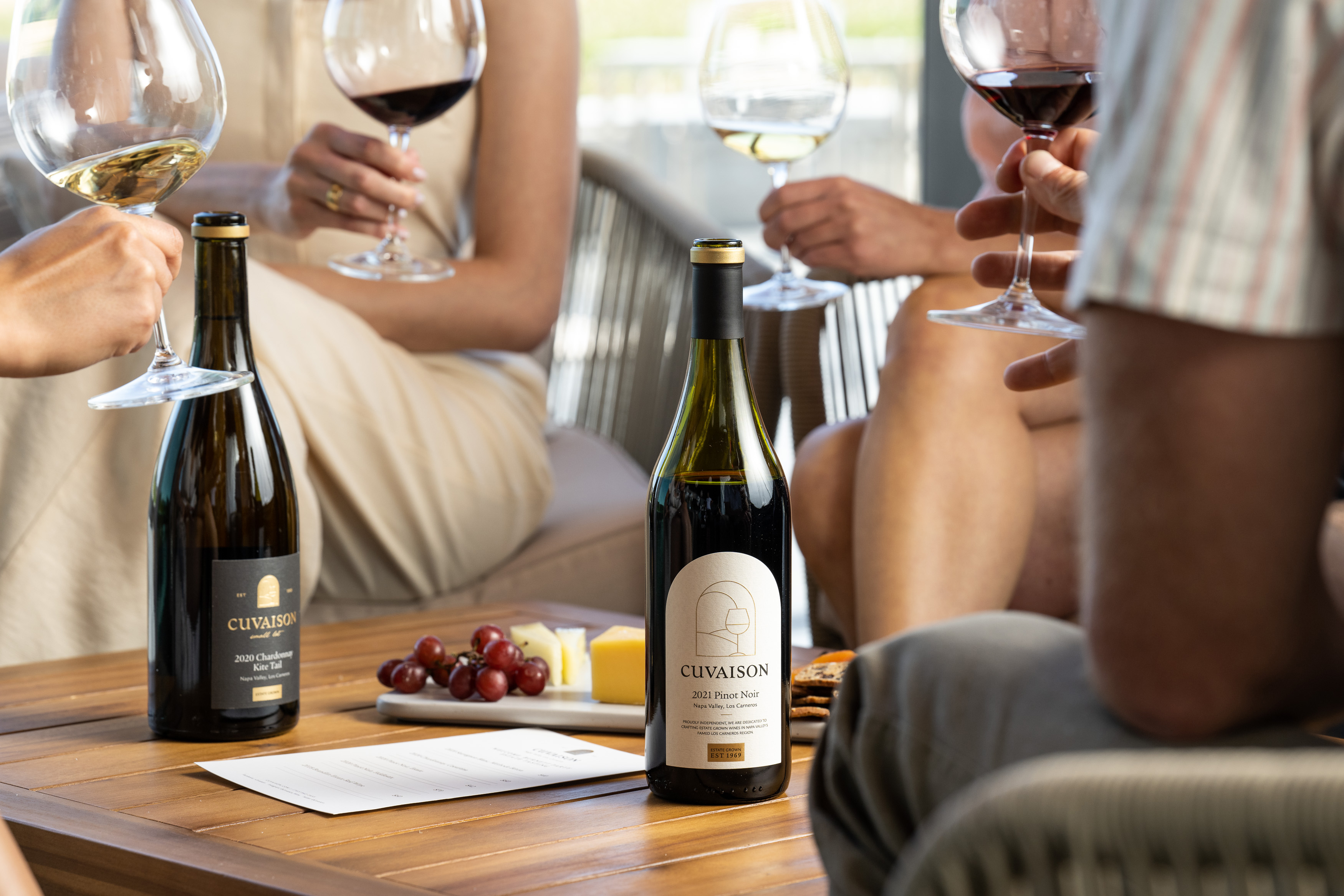 Close up view of two wine bottles on a table