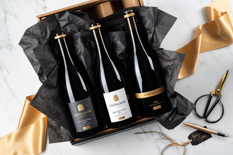Three Cuvaison wines in gift box with gold ribbon and gift tag