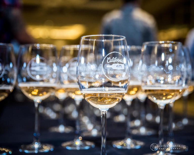 Multiple wine glasses with white wine