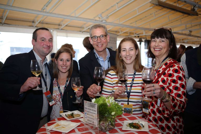 Five friends toast the viewer at the Nantucket Wine and Food Festival